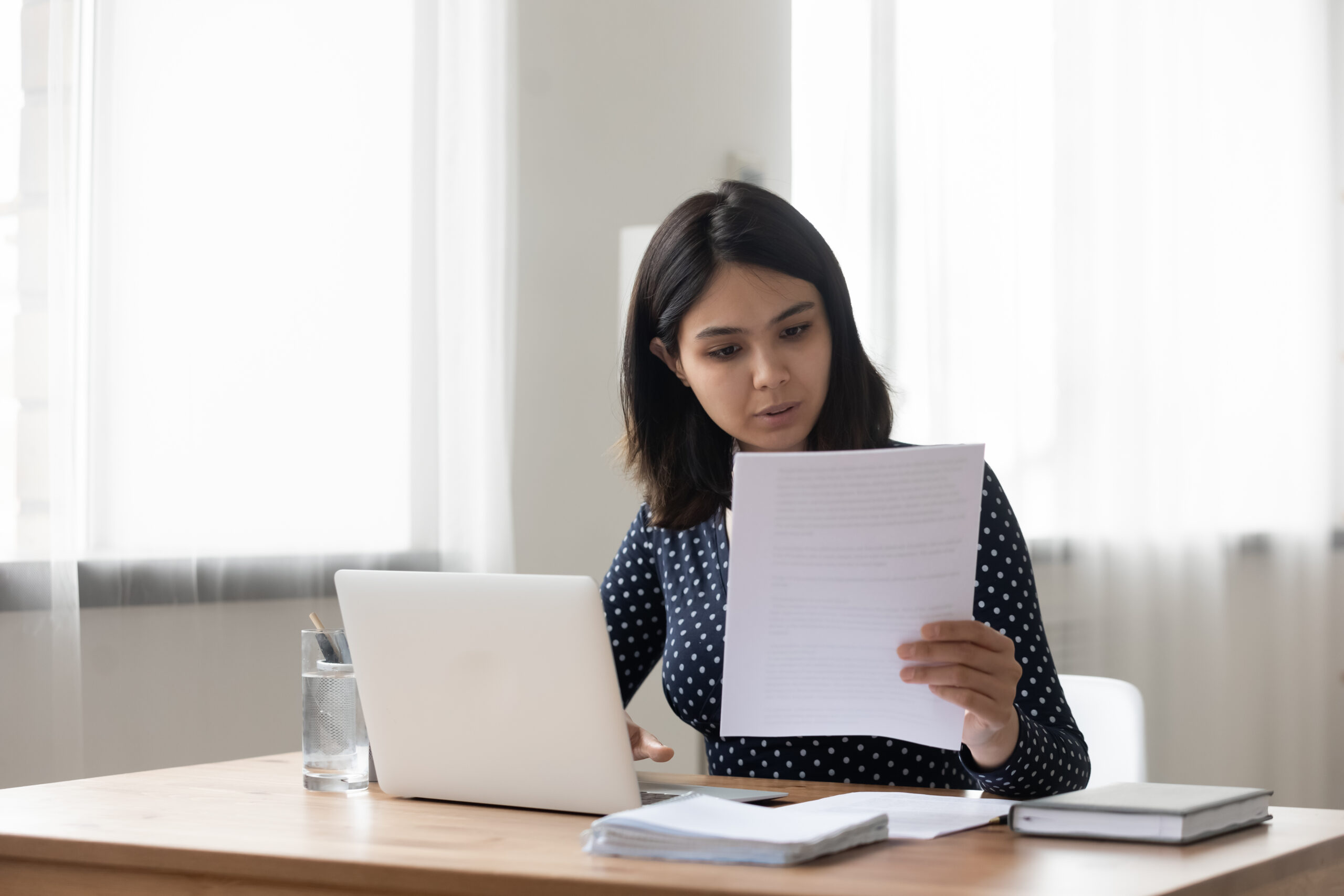 Young woman reading cover letter