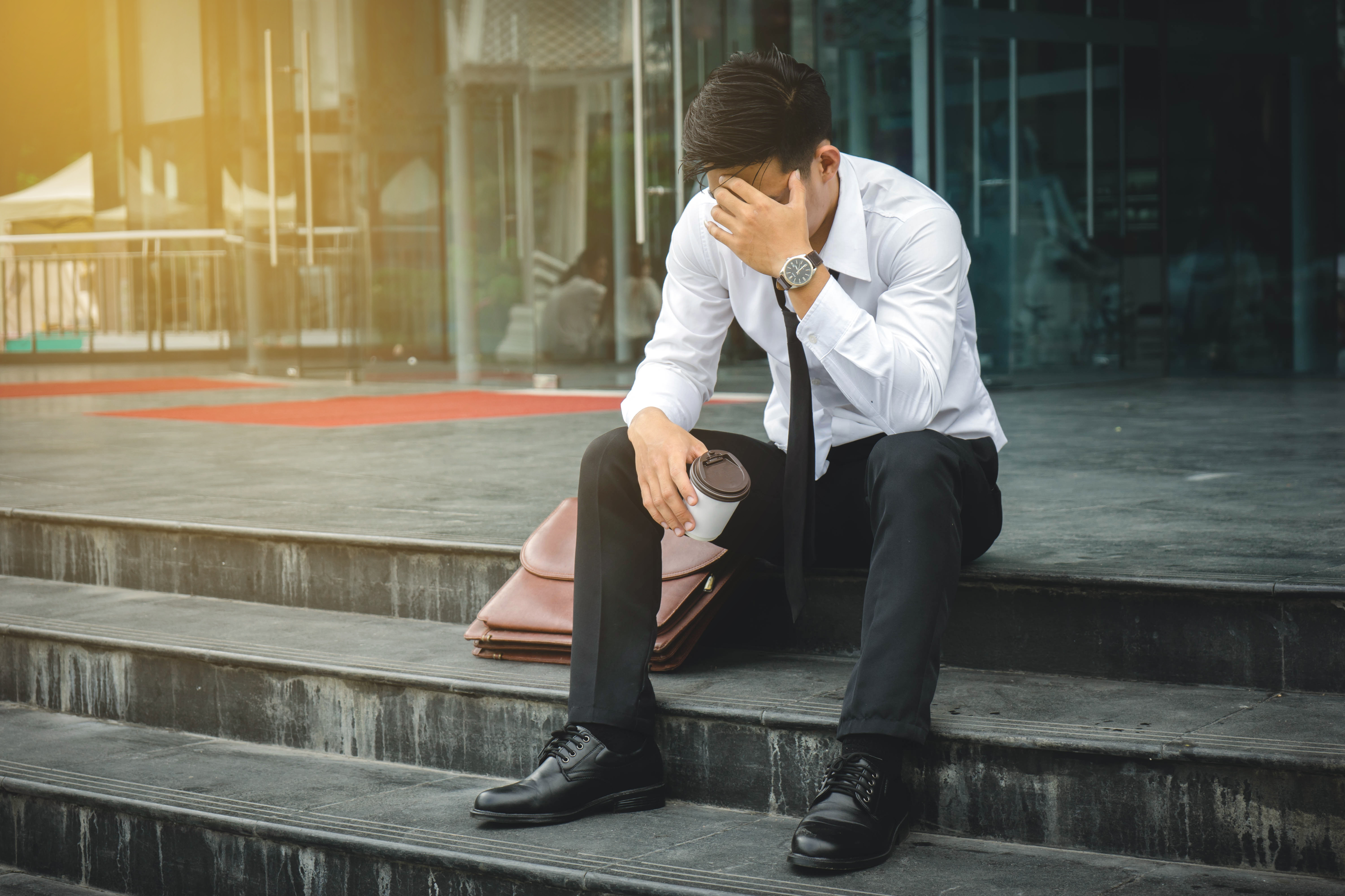 Unemployed Man Sad on Steps Unemployed Man Sad on Steps