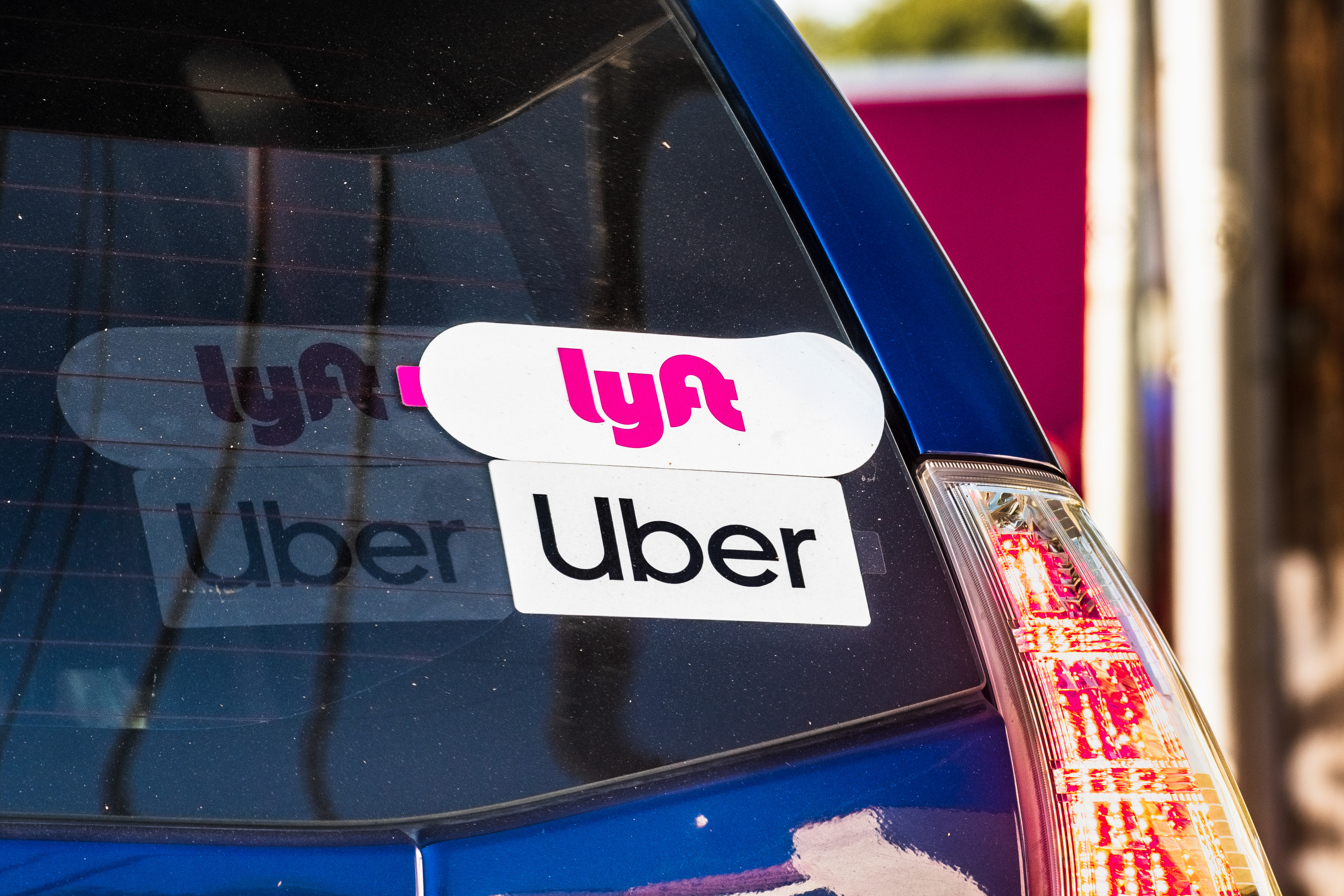 Car with Uber and Lyft Sticker on it Car with Uber and Lyft Sticker on it