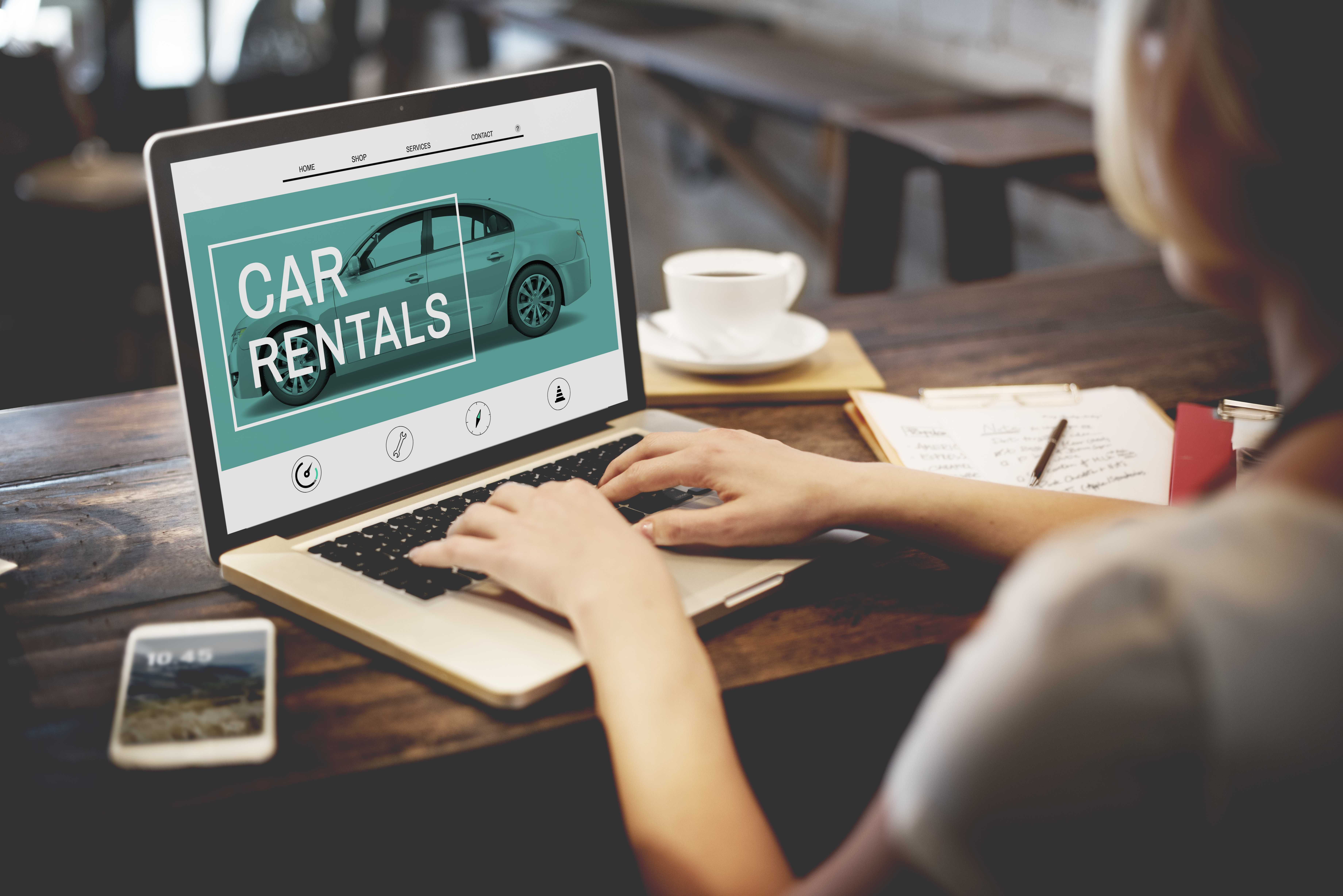 Woman Looking at Car Rental Website Woman Looking at Car Rental Website