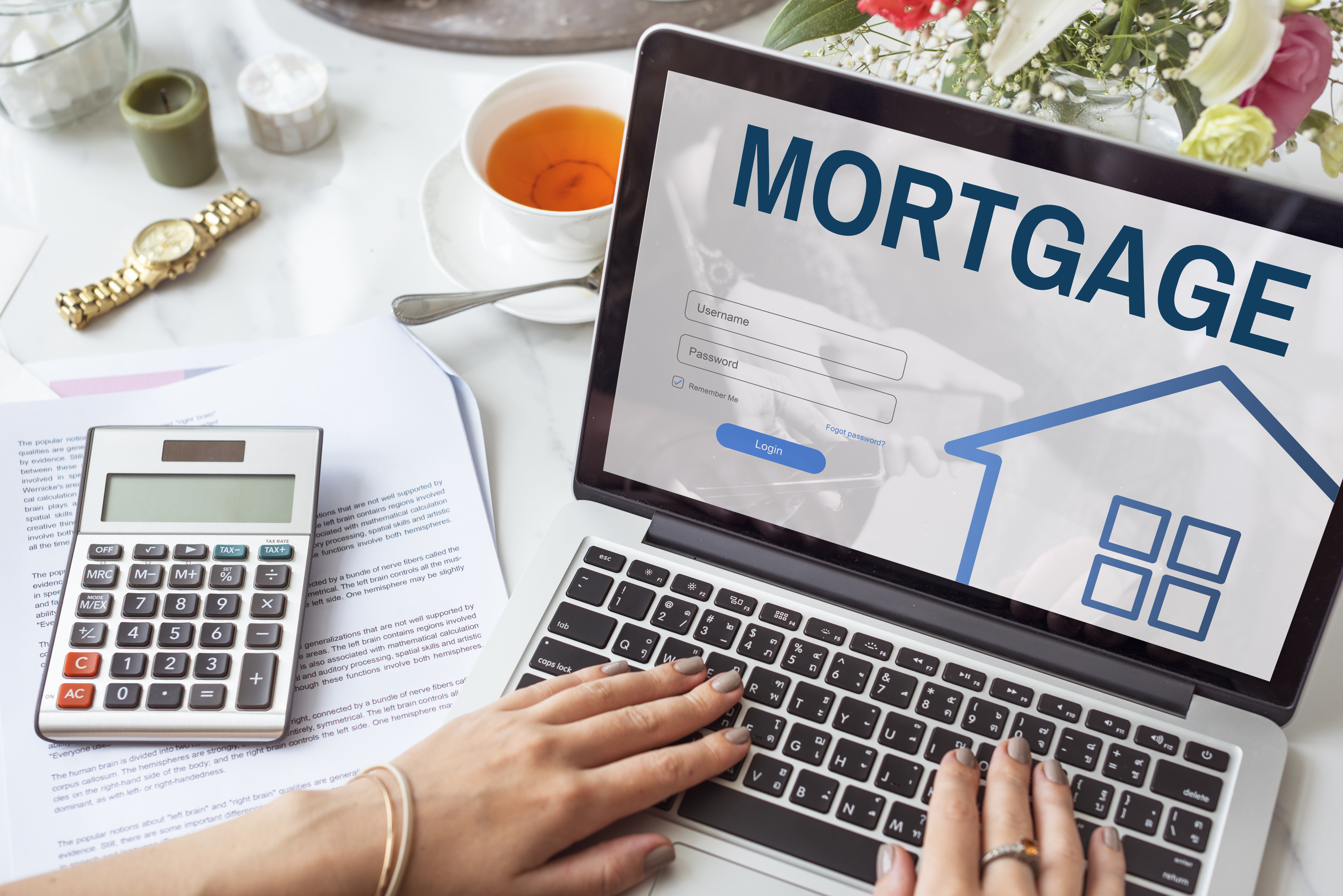 Woman Filling Out Online Mortgage Application Woman Filling Out Online Mortgage Application