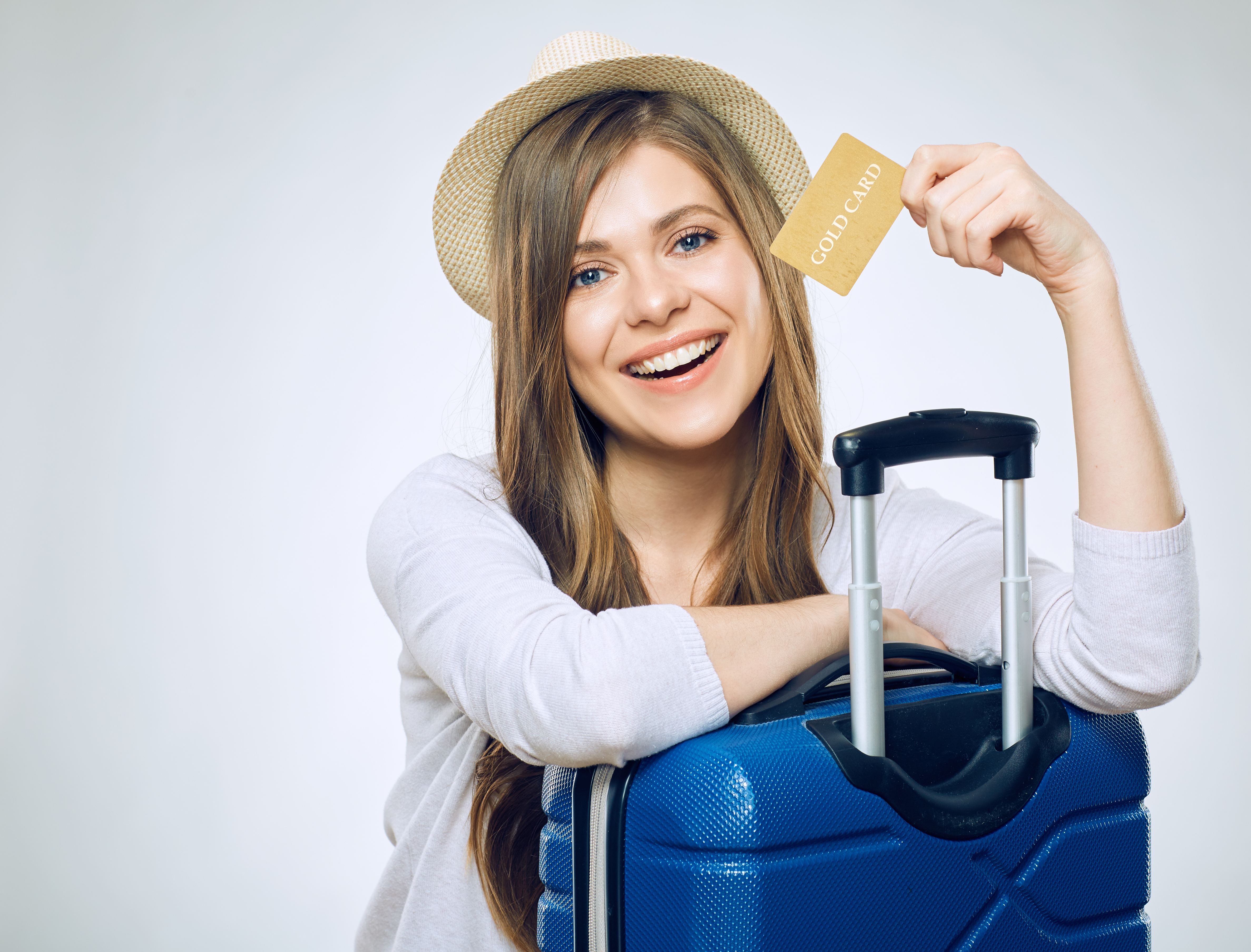 Woman with Credit Card and Travel Luggage Woman with Credit Card and Travel Luggage