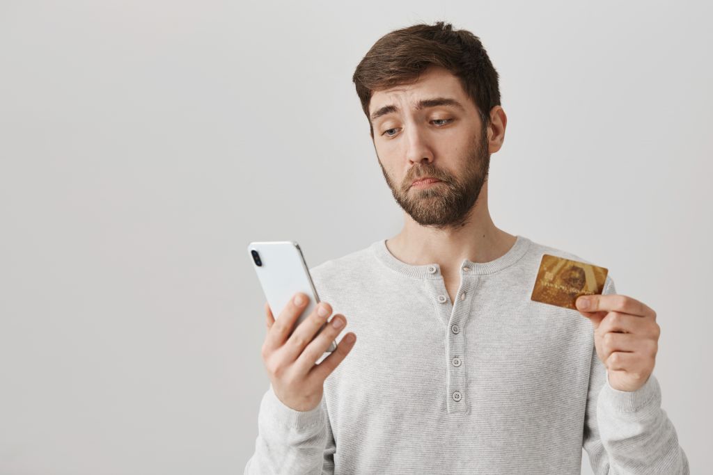 Man with Credit Card and Phone Man with Credit Card and Phone