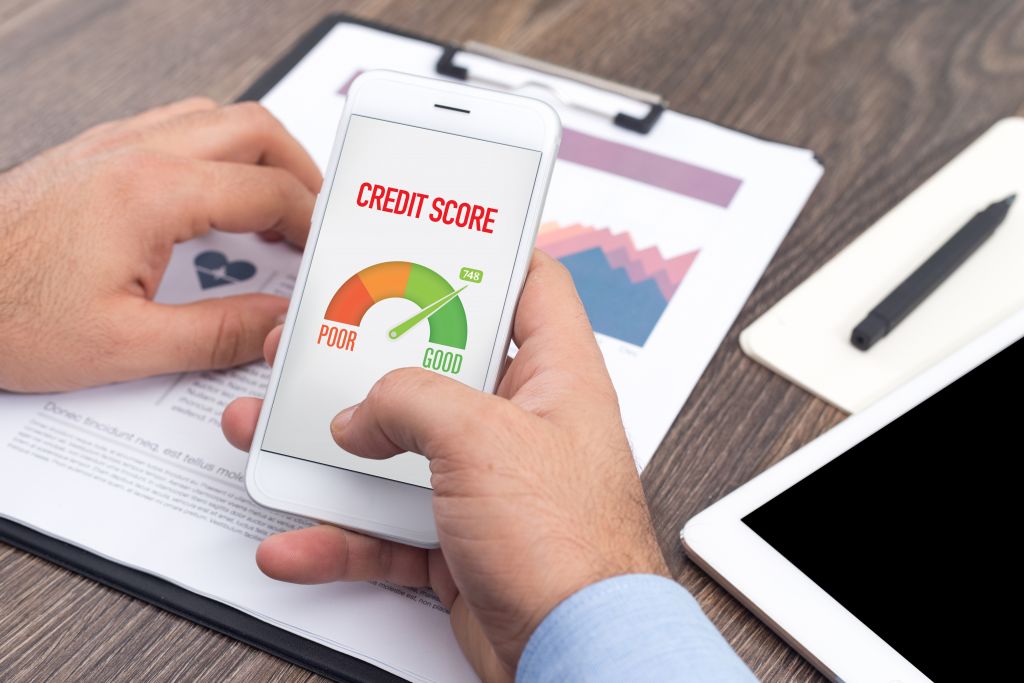 Man Checking Credit Score on Phone Man Checking Credit Score on Phone