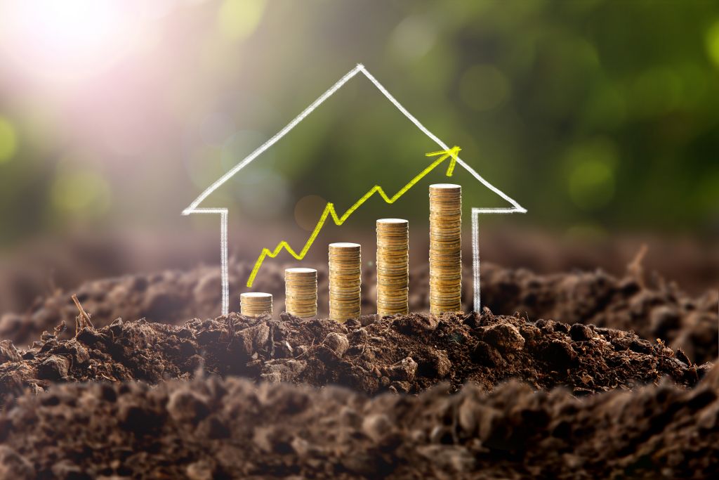 House and Coin Stack Accenting Upward Trend Graph House and Coin Stack Accenting Upward Trend Graph