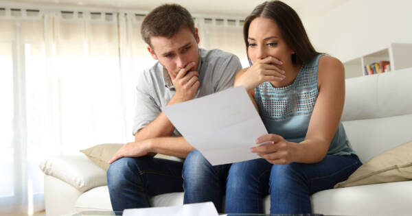 Couple Studying Bankruptcy Documents