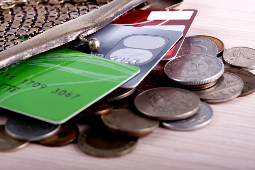 Open Wallet Spilling Credit Cards and Coins Open Wallet Spilling Credit Cards and Coins