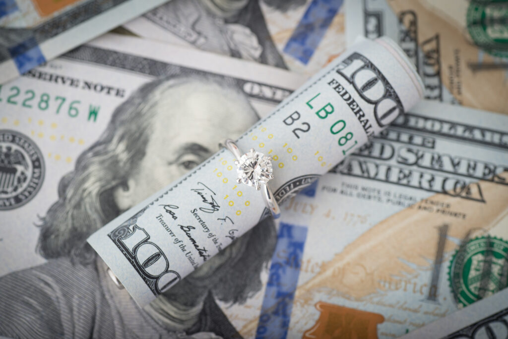 Wedding Ring Around Rolled Up $100 Dollar Bill Wedding Ring Around Rolled Up $100 Dollar Bill