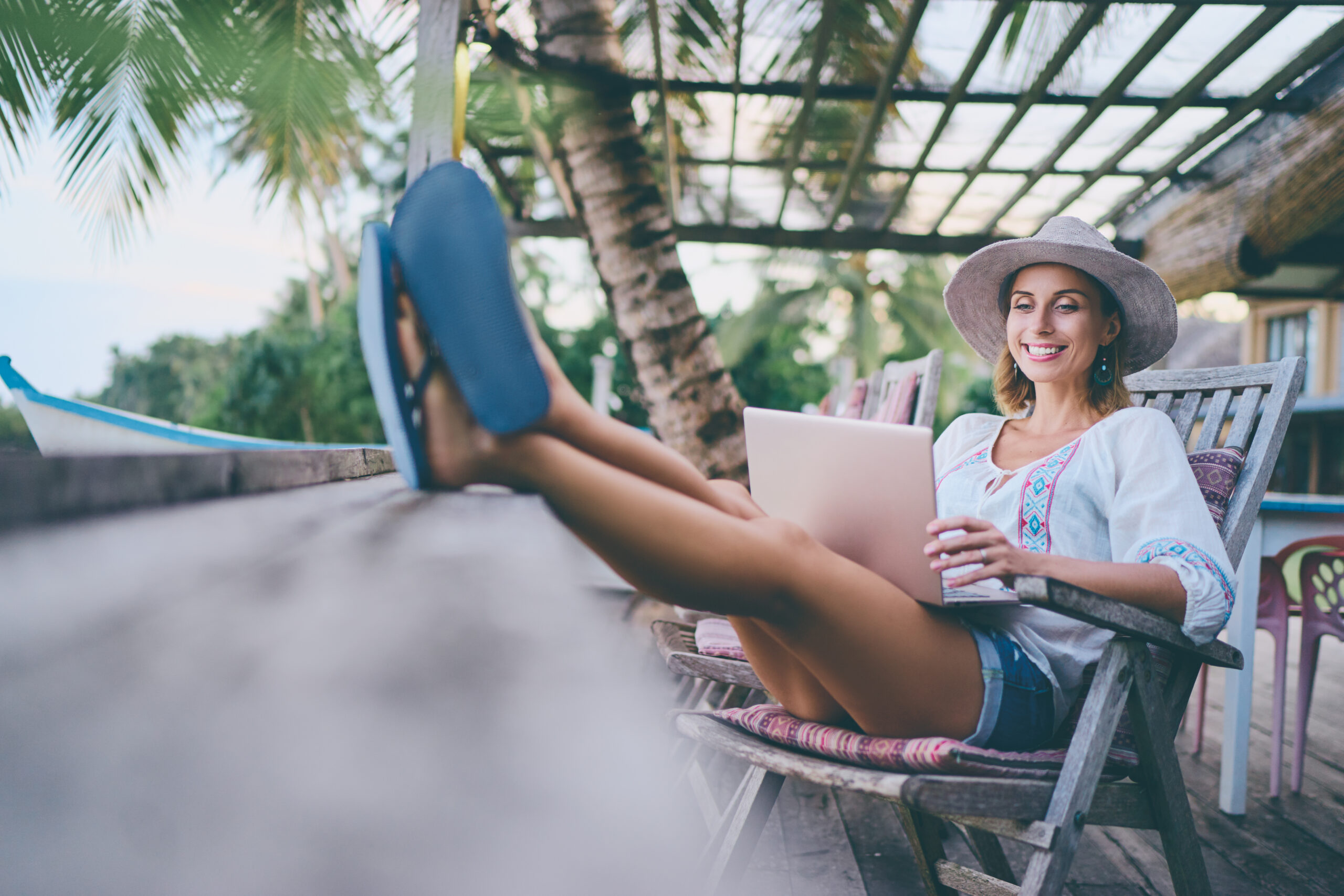 Woman Relaxing on Vacation with Laptop Woman Relaxing on Vacation with Laptop