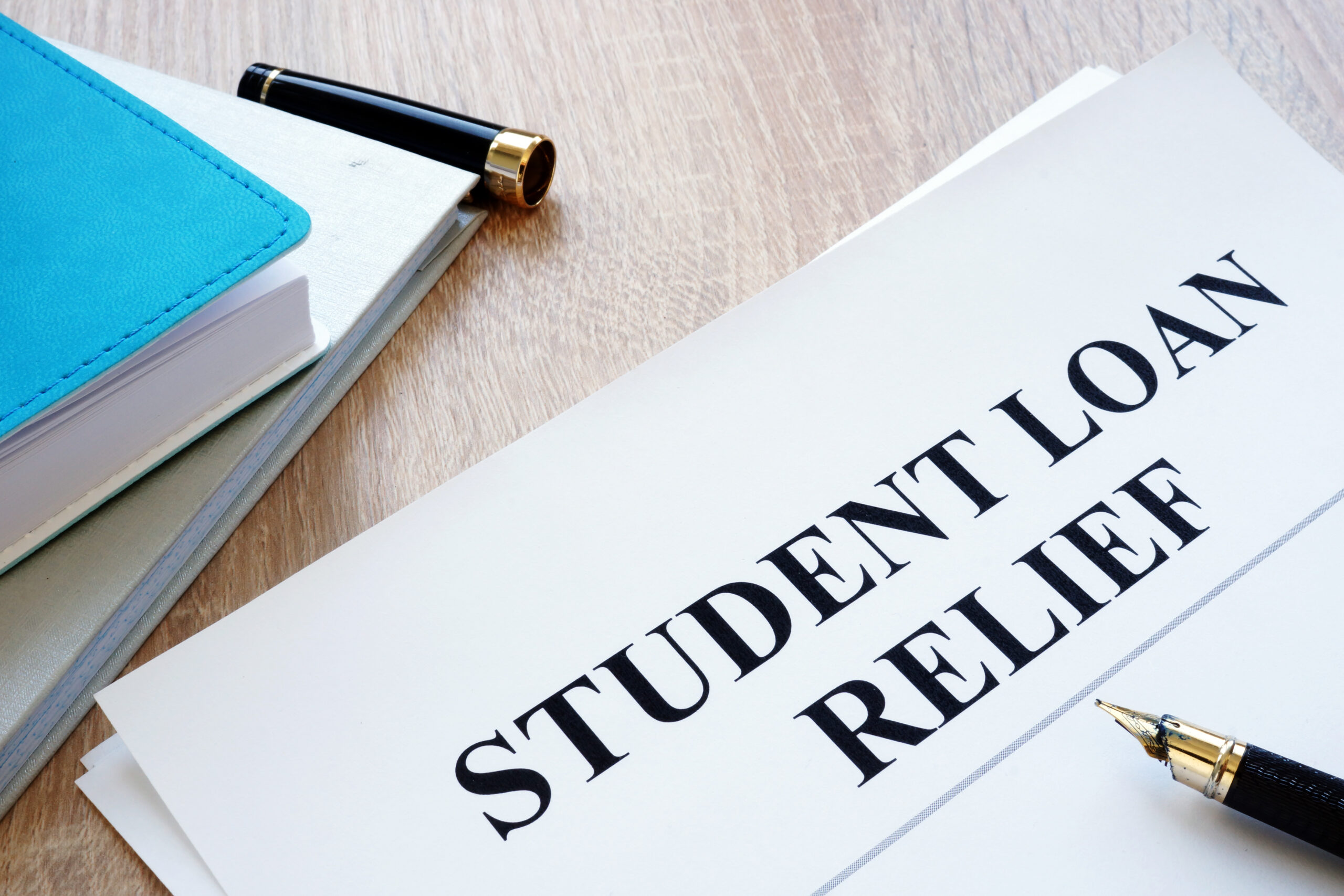 Student Loan Relief Application on Table Student Loan Relief Application on Table