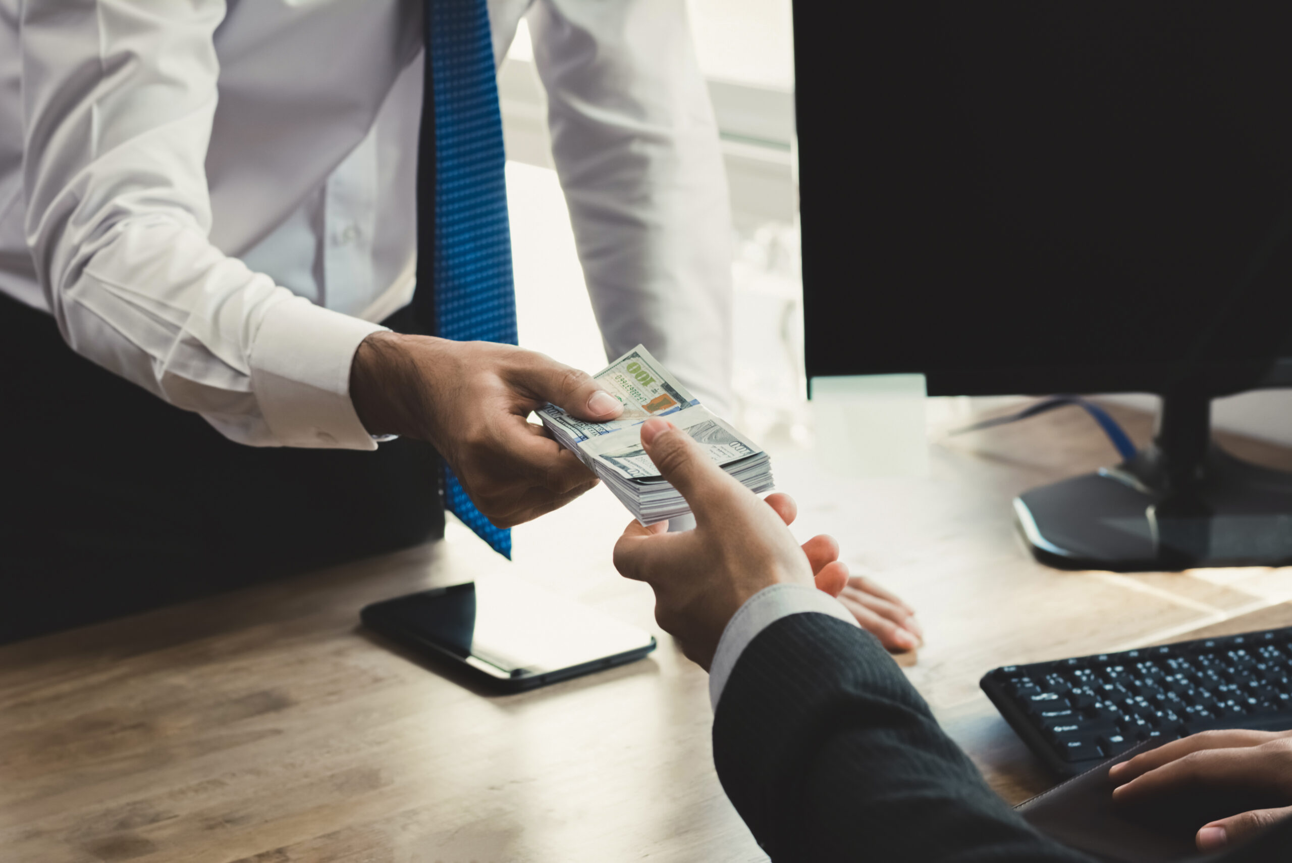 Lender Exchanging Cash with Client Lender Exchanging Cash with Client