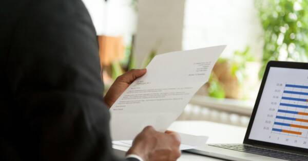 Man Looking at Cover Letter