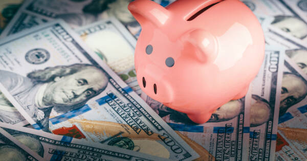 Scattered Cash with Piggy Bank