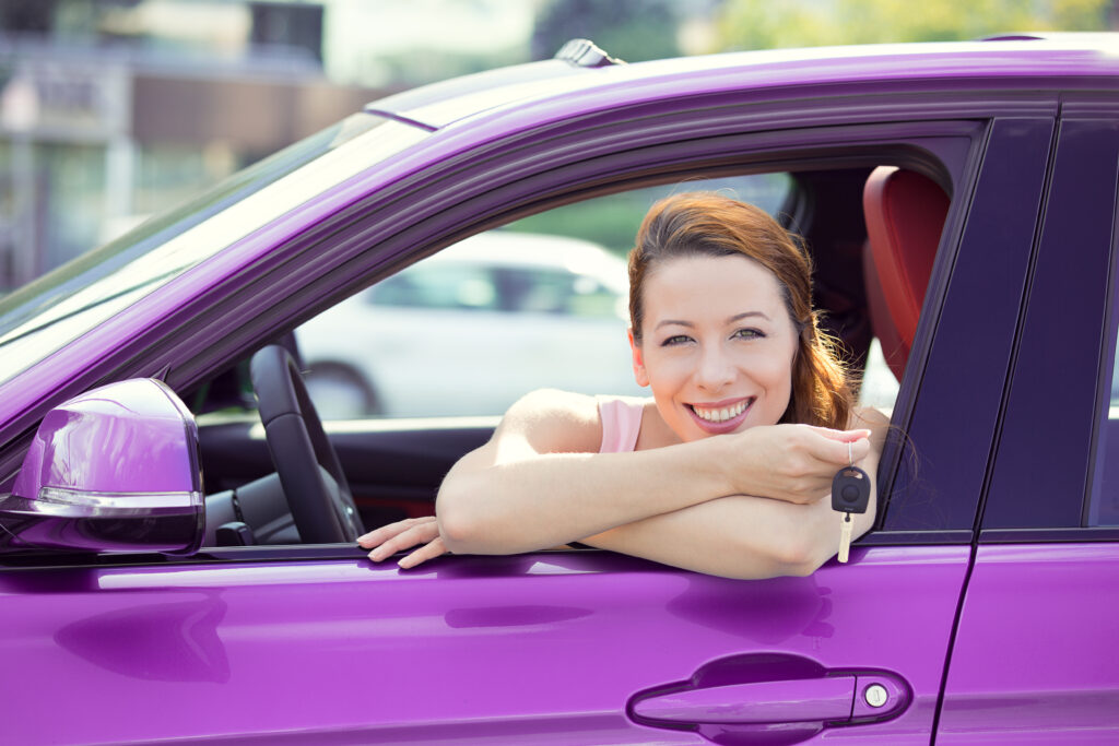 Woman Excited with New Purple Car Woman Excited with New Purple Car