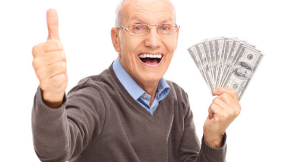 Man Celebrating Making Money with Cash in Hand