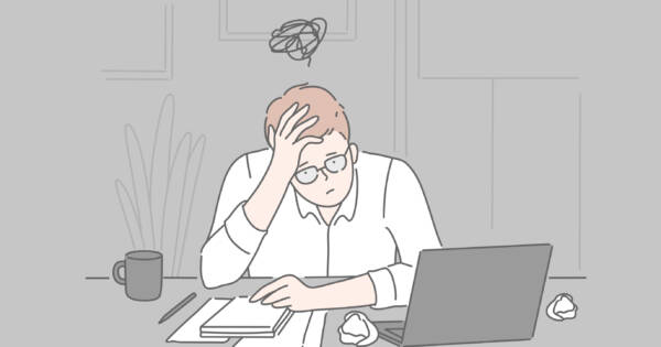 Fatigued Man at Work Desk
