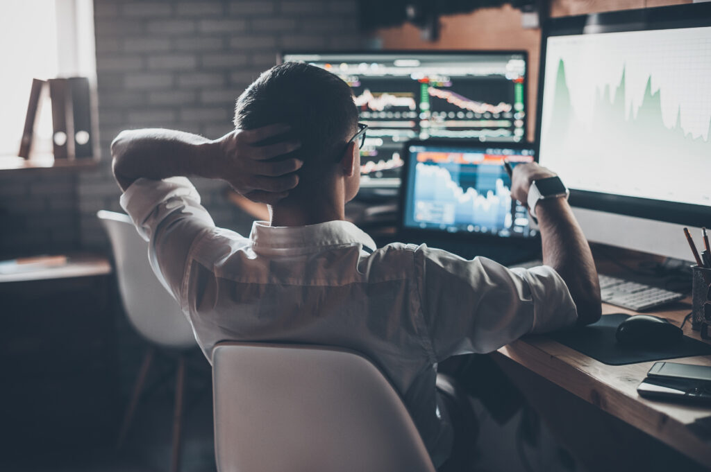 Man Alone Investing on Computer Man Alone Investing on Computer