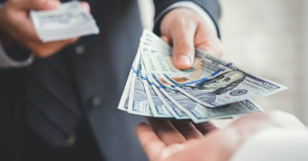 Man Lending Money to Friend
