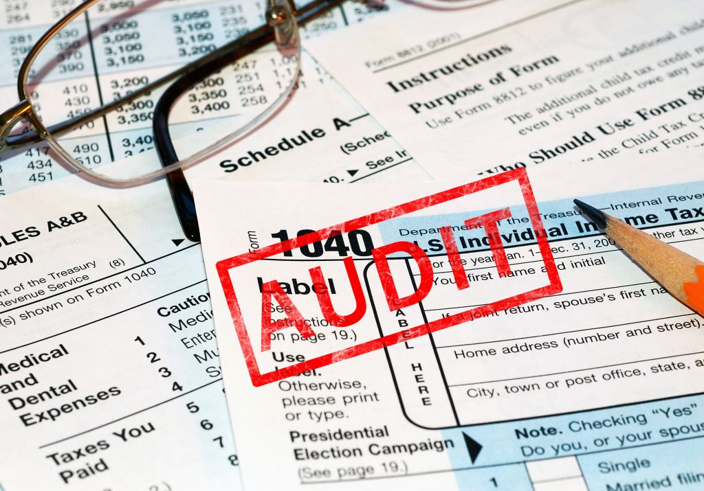 Tax Documents Stamped with Red Audit Label Tax Documents Stamped with Red Audit Label