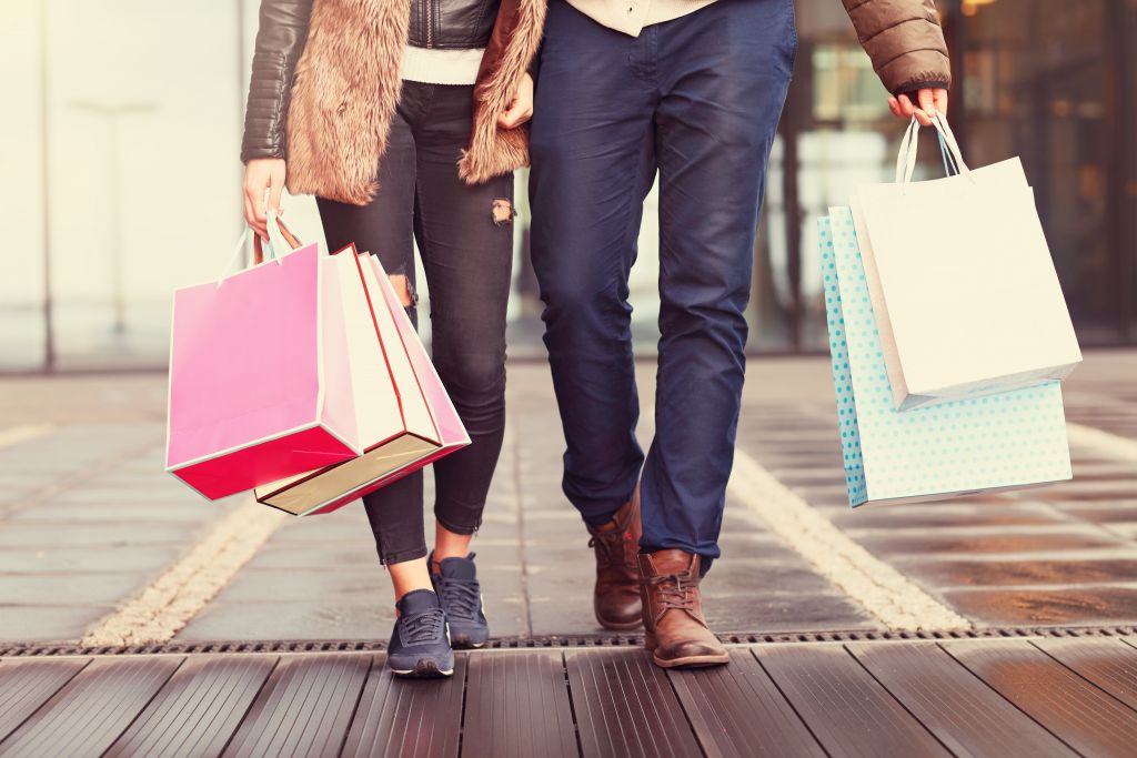 Couple with Shopping Bags at Retailer Couple with Shopping Bags at Retailer