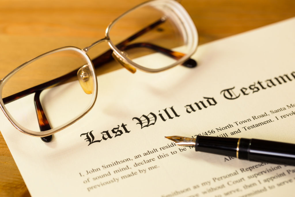 Last Will and Testament Document on Table Last Will and Testament Document on Table