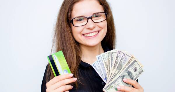 Credit Card and Cash in Hand