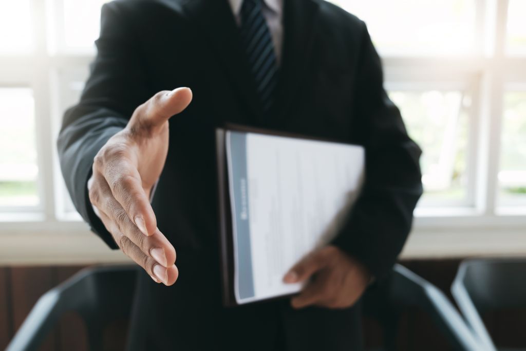 Business Man Offering Hand Shake Business Man Offering Hand Shake