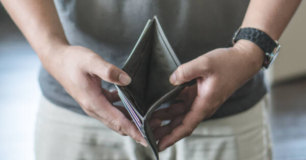 Man Opening Empty Wallet