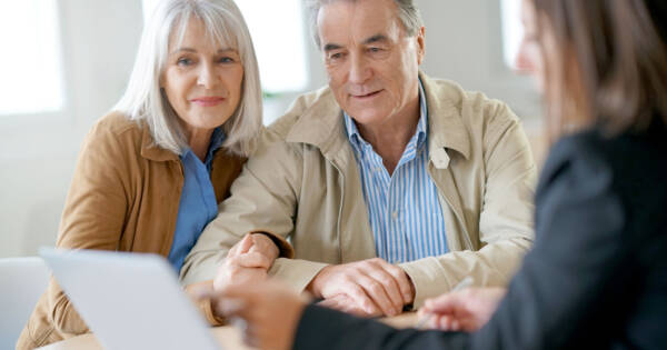 Retiring Couple Discussing Finances with Professional