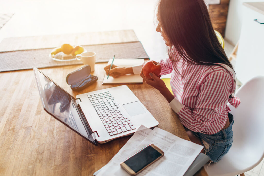 Woman Working on Budget at Desk Woman Working on Budget at Desk