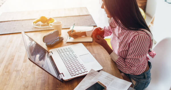 Woman Working on Budget at Desk
