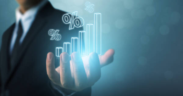 Man Holding Growth Chart in Hand