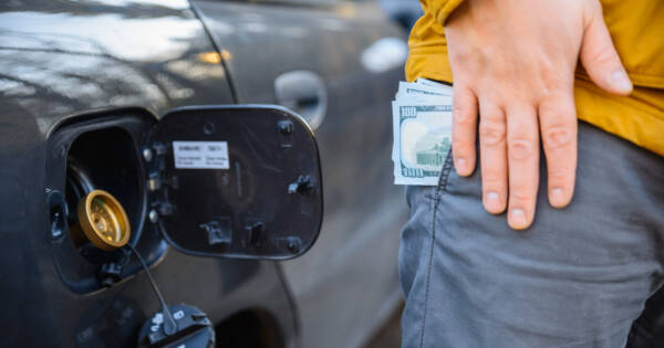 Cash in Pocket by Car Gas Cap