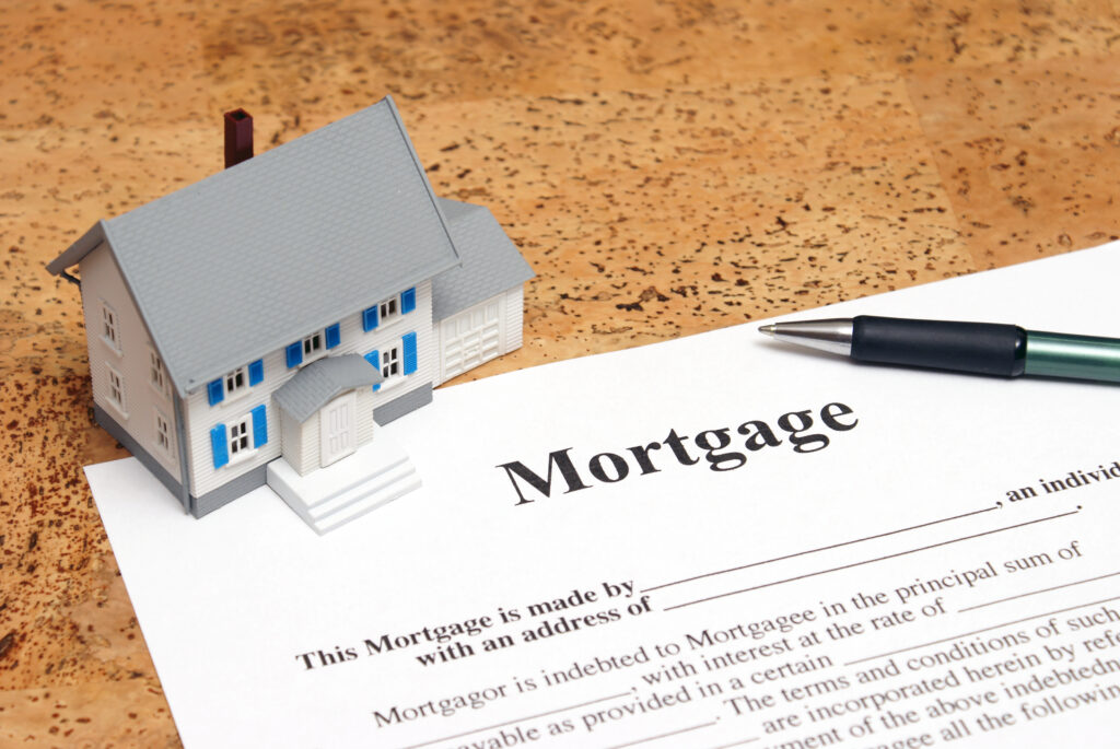 Mini House on Top of Mortgage Application Mini House on Top of Mortgage Application