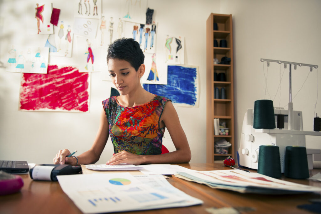 Small Business Owner Crunching Numbers Small Business Owner Crunching Numbers