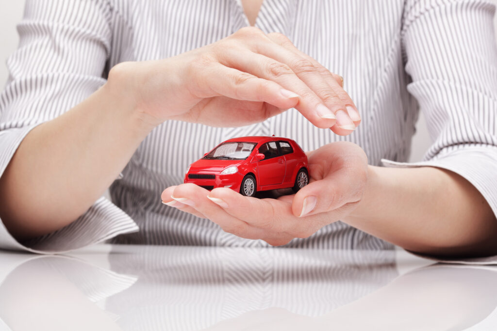 Woman Holding Mini Red Car Woman Holding Mini Red Car