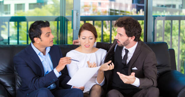 Woman Ignoring Business Men's Advice