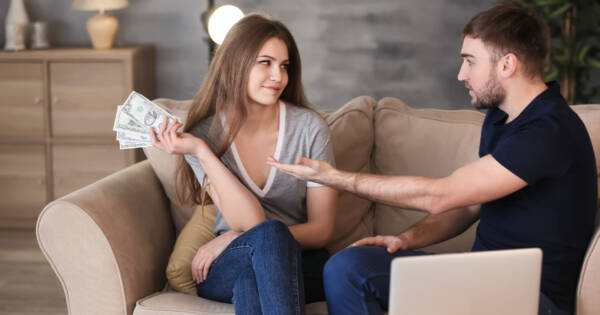 Man Asking for Money and Woman Withholding Cash