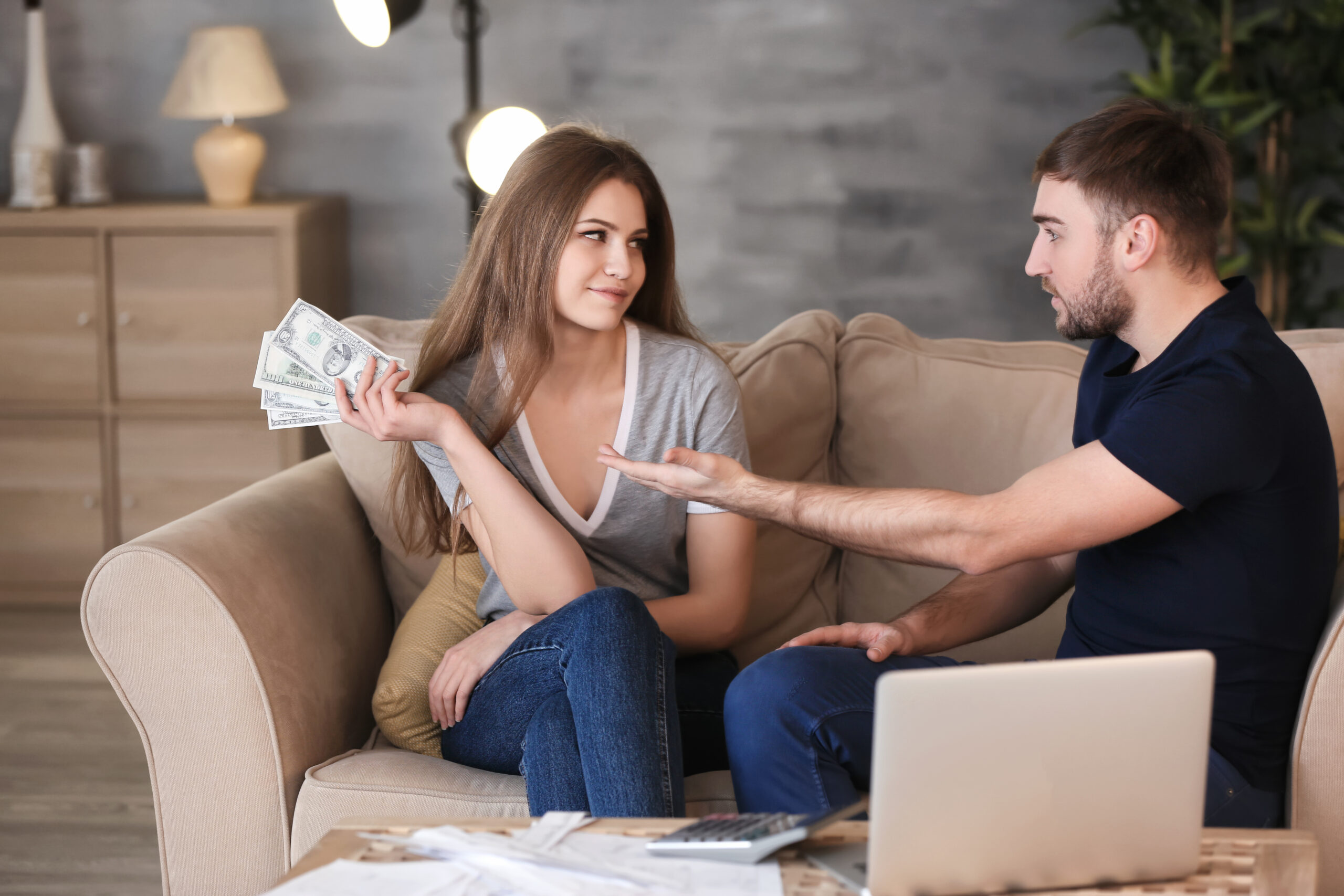 Man Asking for Money and Woman Withholding Cash Man Asking for Money and Woman Withholding Cash