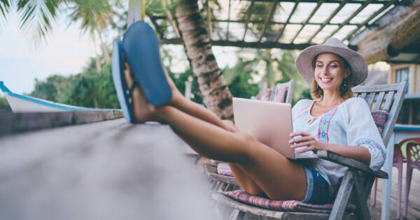 Woman Relaxing on Vacation with Laptop