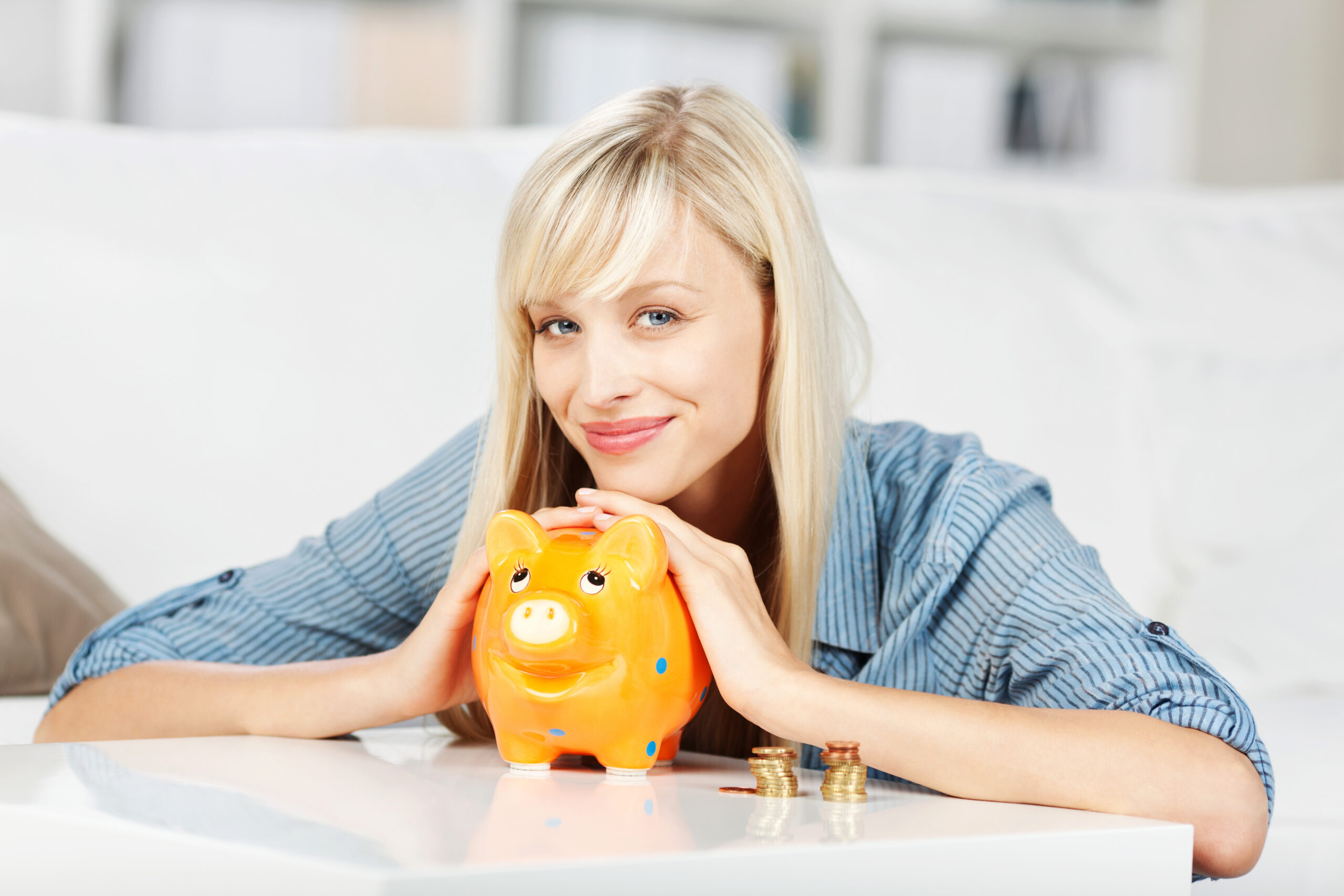 Woman Smiling Holding Piggy Bank Woman Smiling Holding Piggy Bank