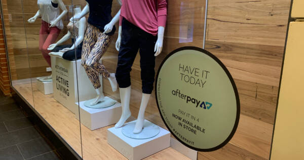 Store Display Window with Buy Now Pay Later Sign