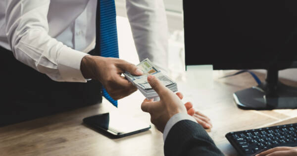 Lender Exchanging Cash with Client