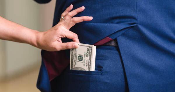 Woman stealing money from man's pocket