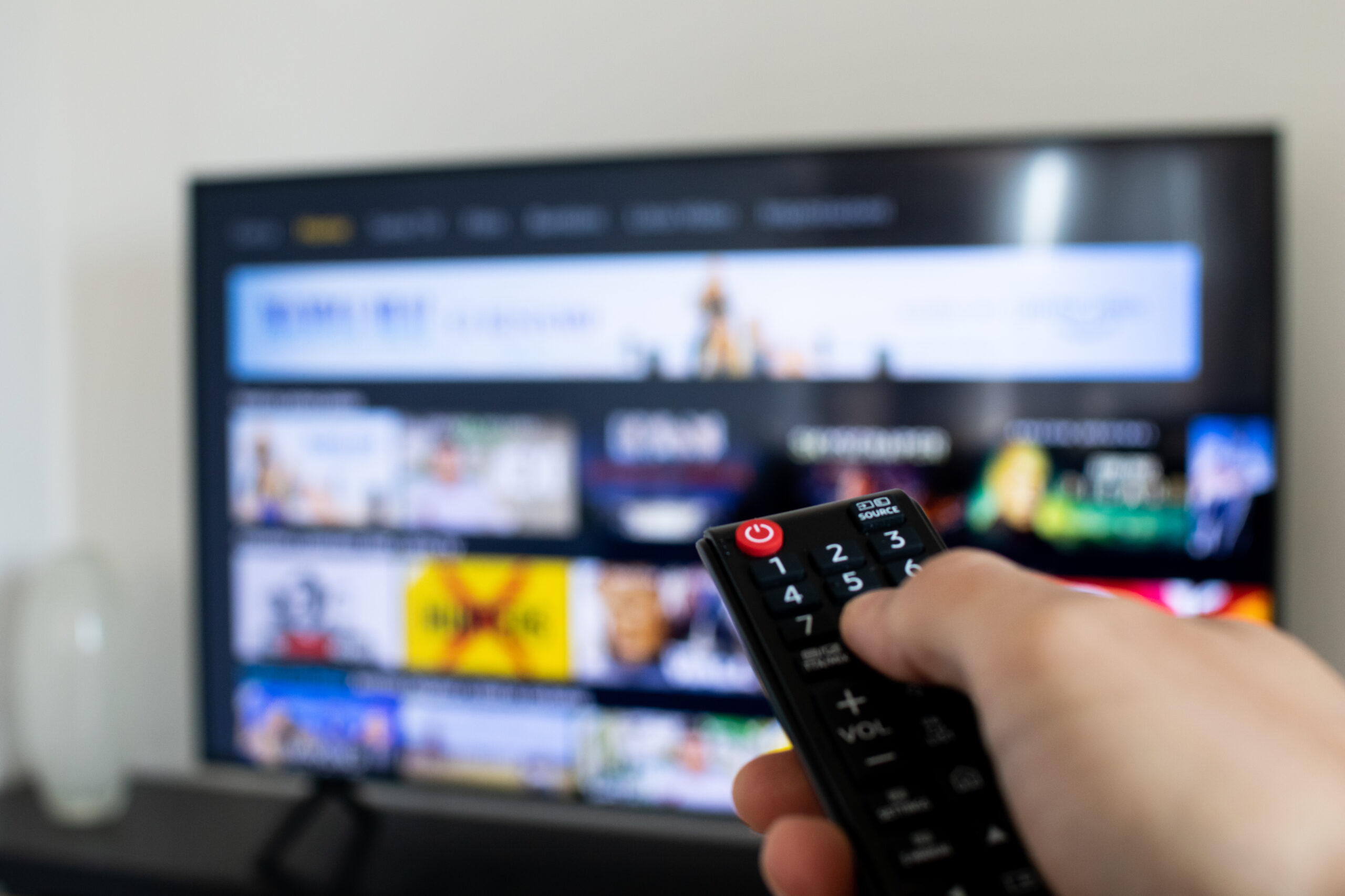 Person Browsing TV App with Remote Person Browsing TV App with Remote