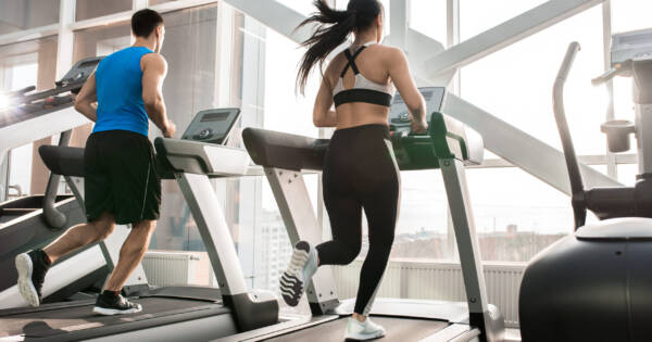 Gym Members Running on Treadmill