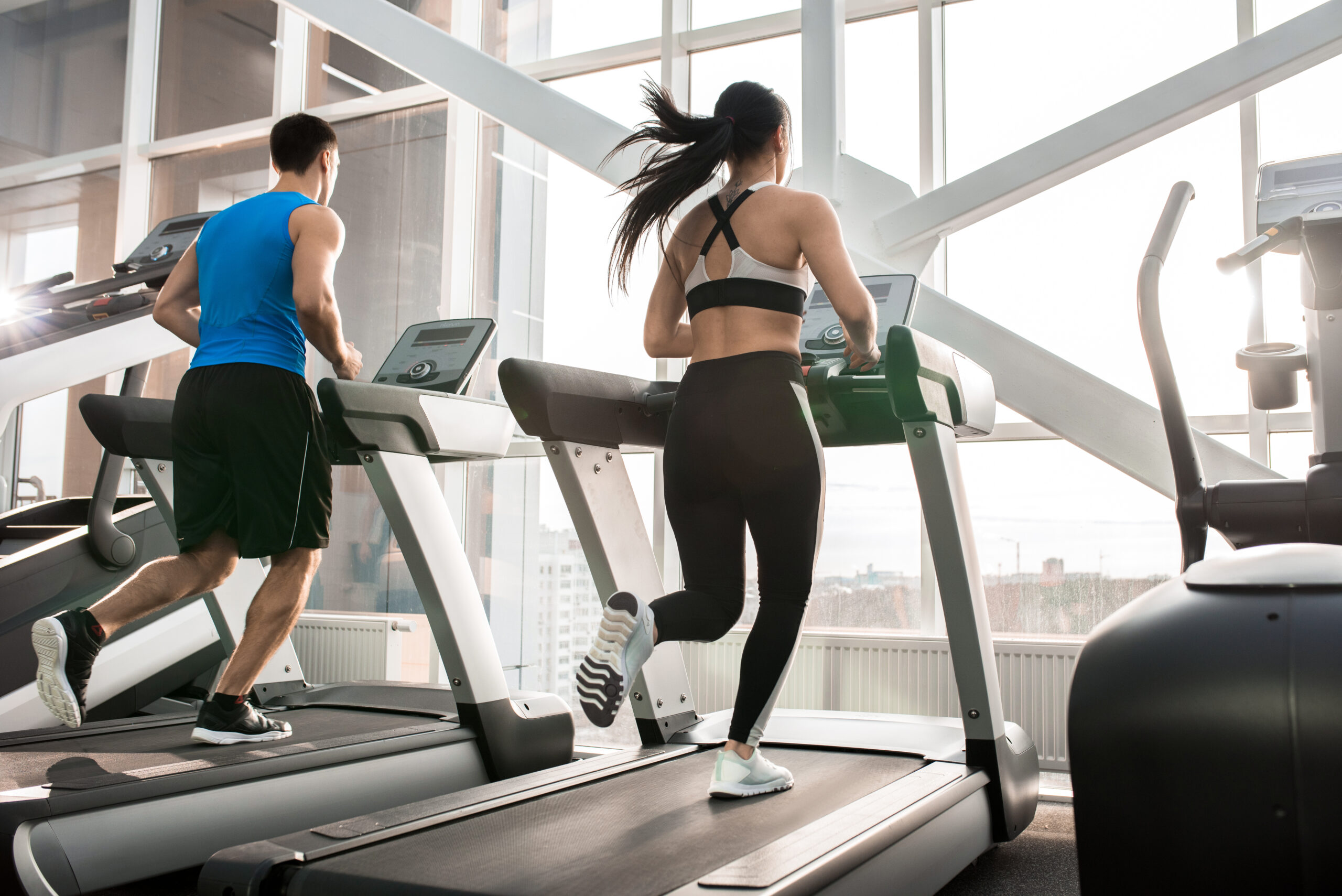 Gym Members Running on Treadmill Gym Members Running on Treadmill
