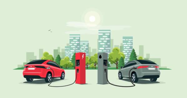 Electric and Gas-Powered Car Fueling Up