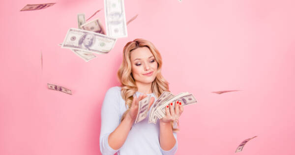 Young woman with extra cash