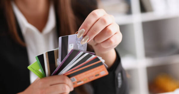 Young woman selecting a credit card